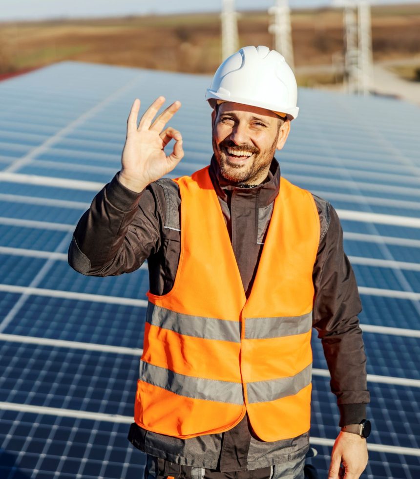 A handyman gesturing with okay sign for renewable and solar energy.